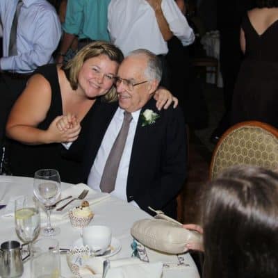 father and adult daughter at wedding