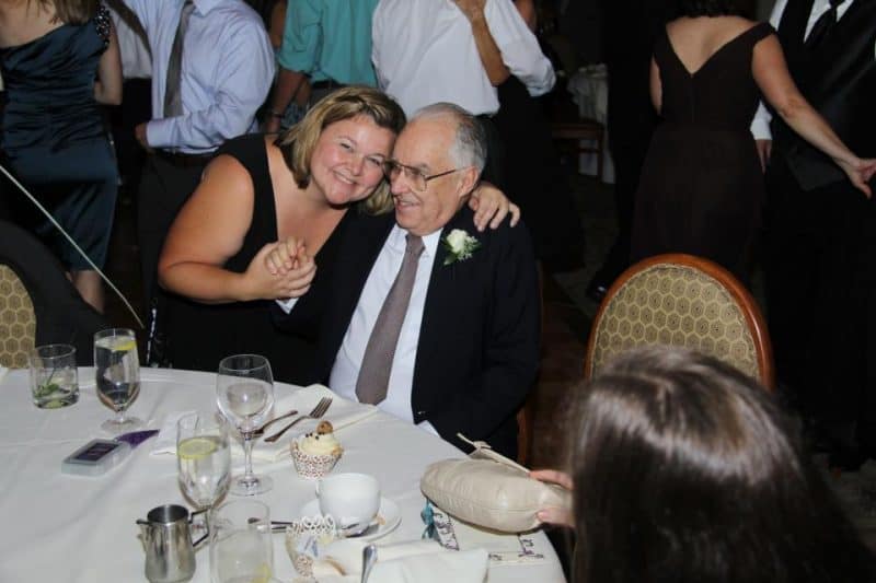 father and adult daughter at wedding