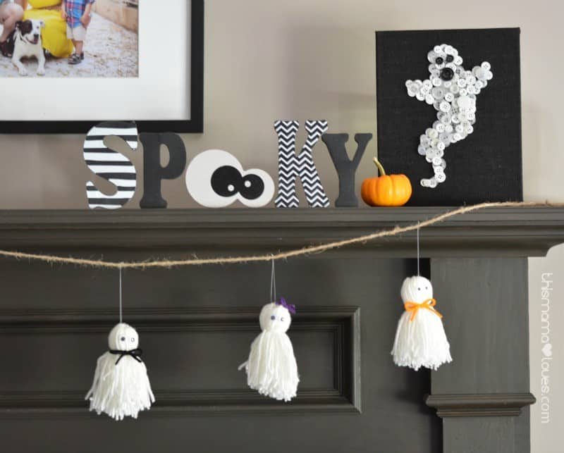 yarn craft ghost garland on black mantel