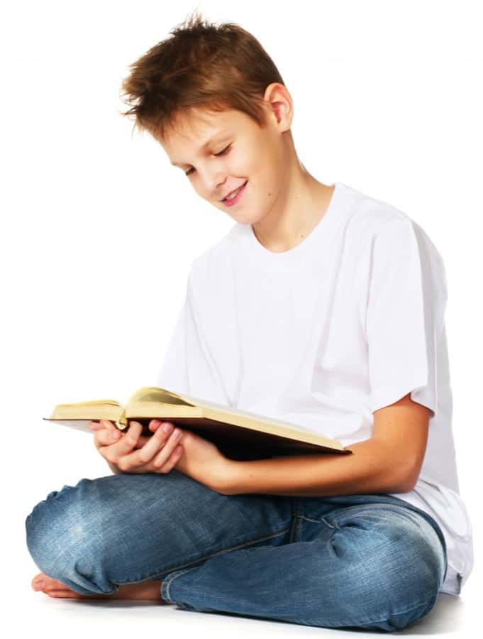 tween boy reading the book