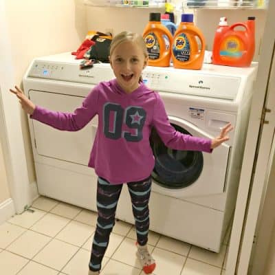 3 reasons to get your kids involved with the laundry 8 year old helps do laundry