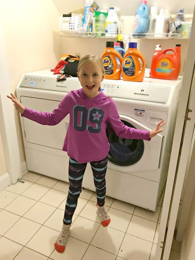 3 reasons to get your kids involved with the laundry 8 year old helps do laundry