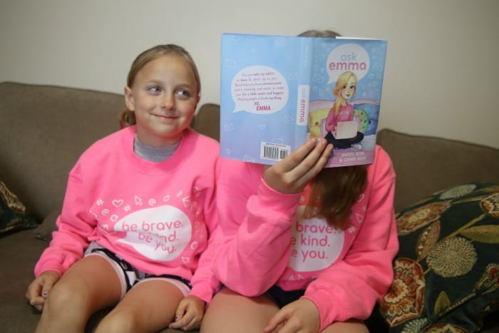 sisters reading ask emma book