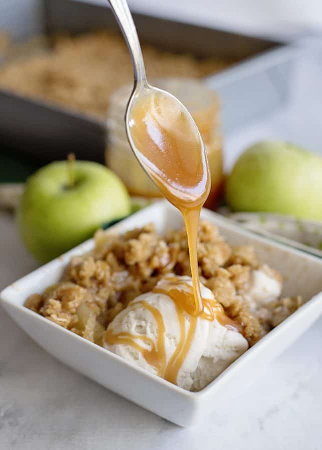 apple crisp and vanilla ice cream drizzled with homemade caramel sauce