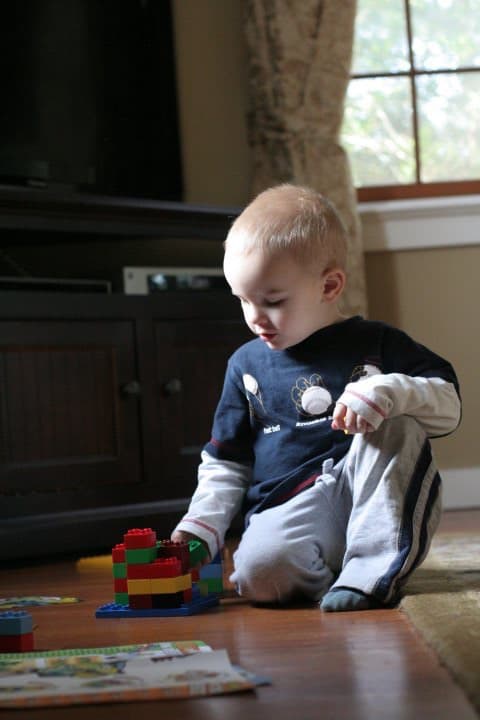 toddler playing lego