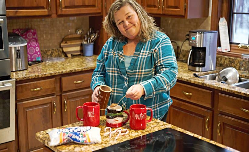 making cooca with rae dunn red holiday mugs