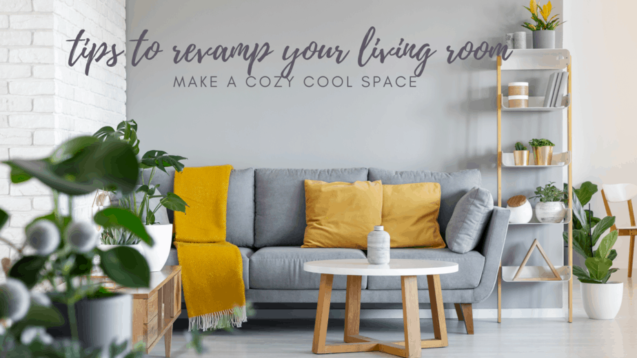 grey couch with mustard cushions in front of grey accent wall