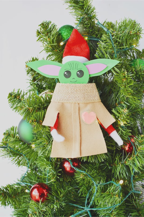 elf on the shelf with baby yoda costume over it 