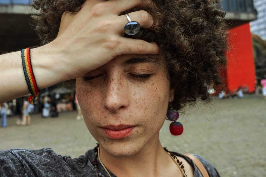 woman holding temple with eyes closed