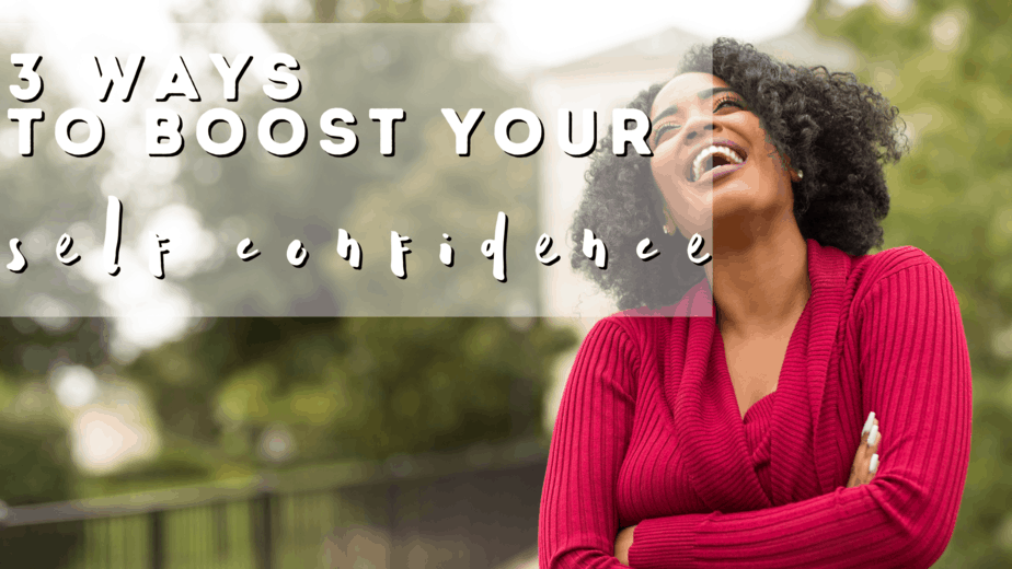 black woman outdoors with red top laughing