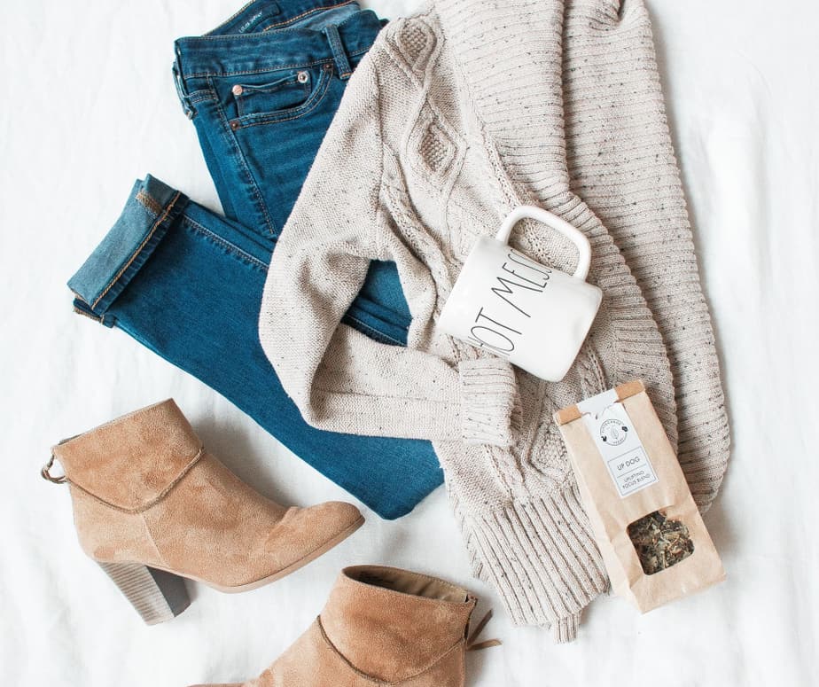 overlay of neutral toned outfit with jeans