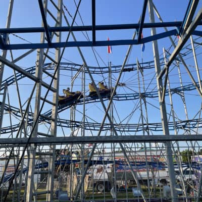 kids on a coaster at a local fair