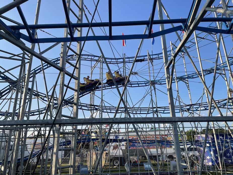 kids on a coaster at a local fair 