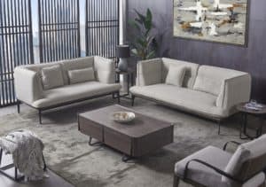 sleek living room with greys and beiges in carpet and couches